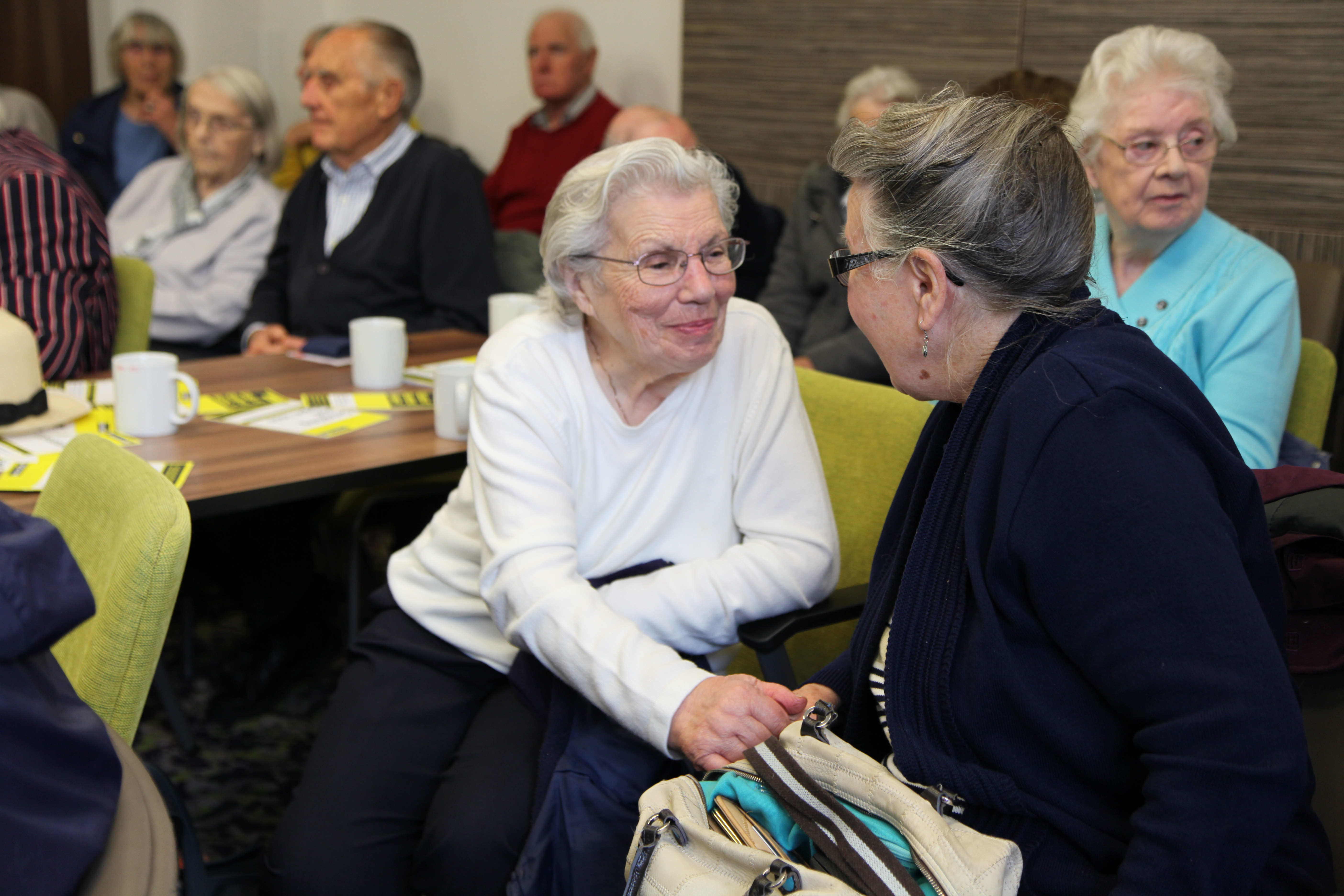 Harlow group smiling and talking