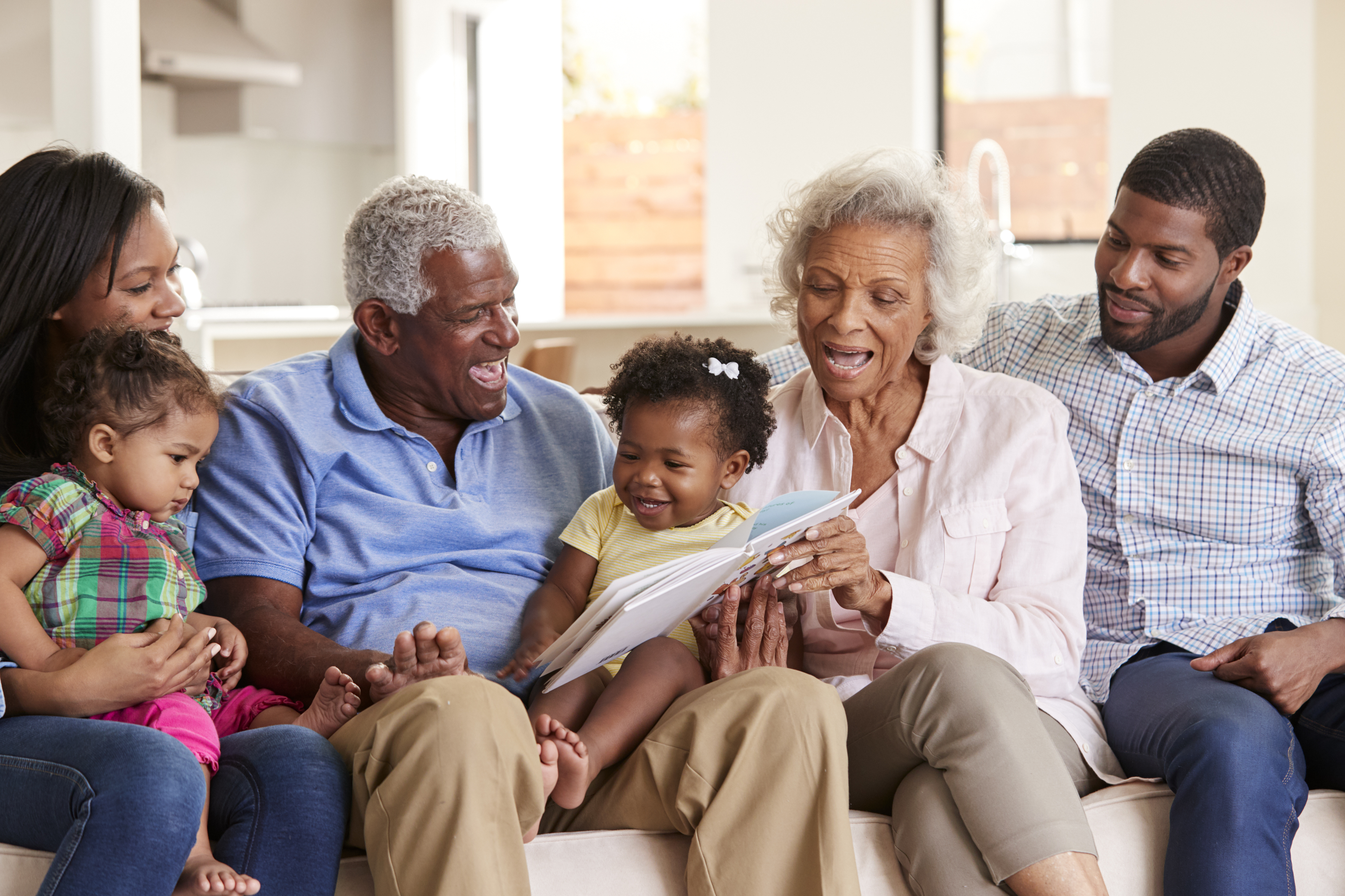 Multi-generational family reading together
